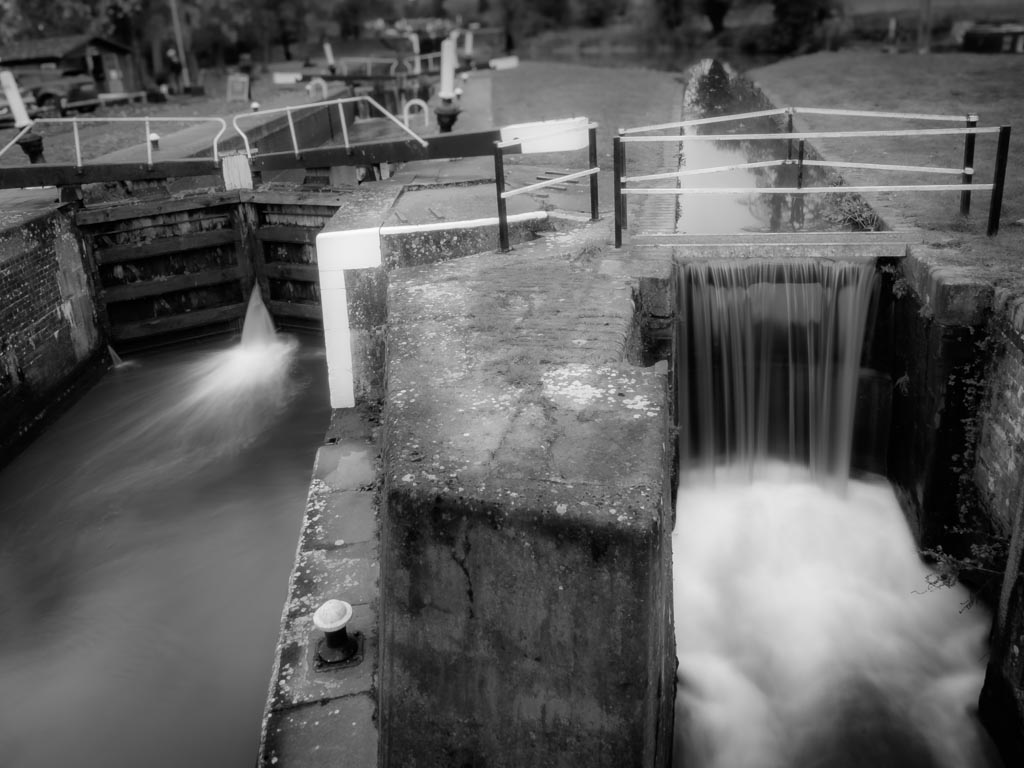 Landscape photograph — Black and white autumn canal view of lock at Hatton Locks Warwick