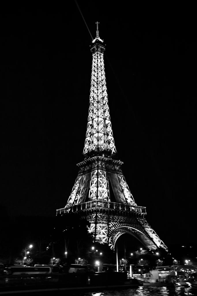 Travel photograph — Eiffel tower at night in black and white Paris