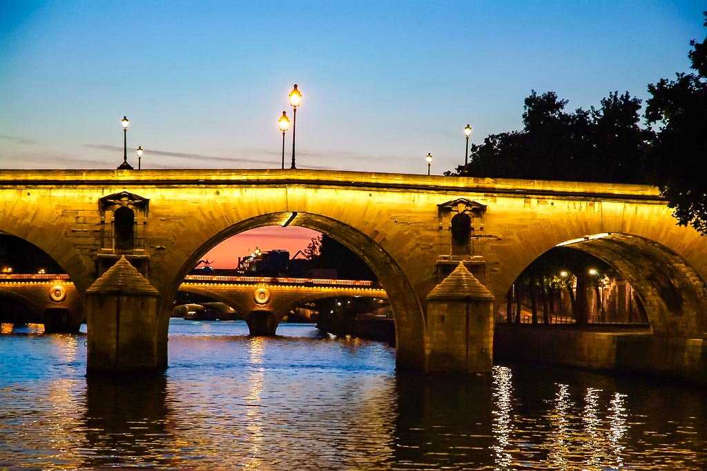 Travel photograph — Night time view of Paris bridge
