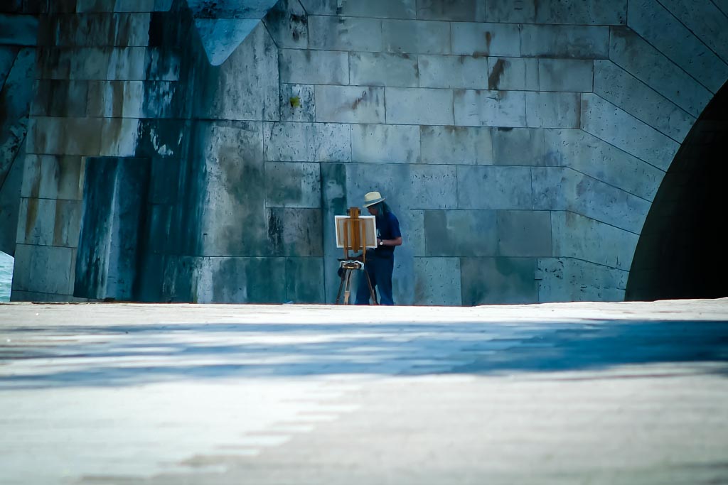 Travel photograph — Parisian artist painting in Paris