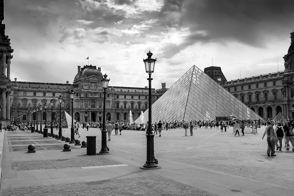 Travel photograph — View of Louvre museum in black and white Paris